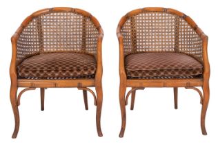 A pair of carved beech and canework bergere chairs,
