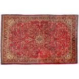 A Bidjar carpet, the wine cartouche field with a central shaded geometric flowerhead pole medallion,