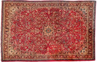 A Bidjar carpet, the wine cartouche field with a central shaded geometric flowerhead pole medallion,