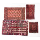 An Afghanistan rug of Turkoman design, the rose field with two rows of quartered octagons,