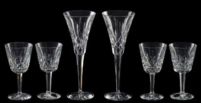 A suite of Waterford Lismore pattern drinking glasses, comprising eight flutes, six goblets,