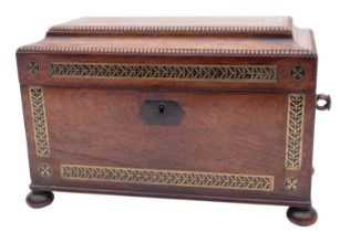 A Regency rosewood and brass inlaid tea caddy, circa 1815; of sarcophagus form,