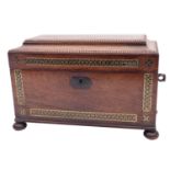 A Regency rosewood and brass inlaid tea caddy, circa 1815; of sarcophagus form,