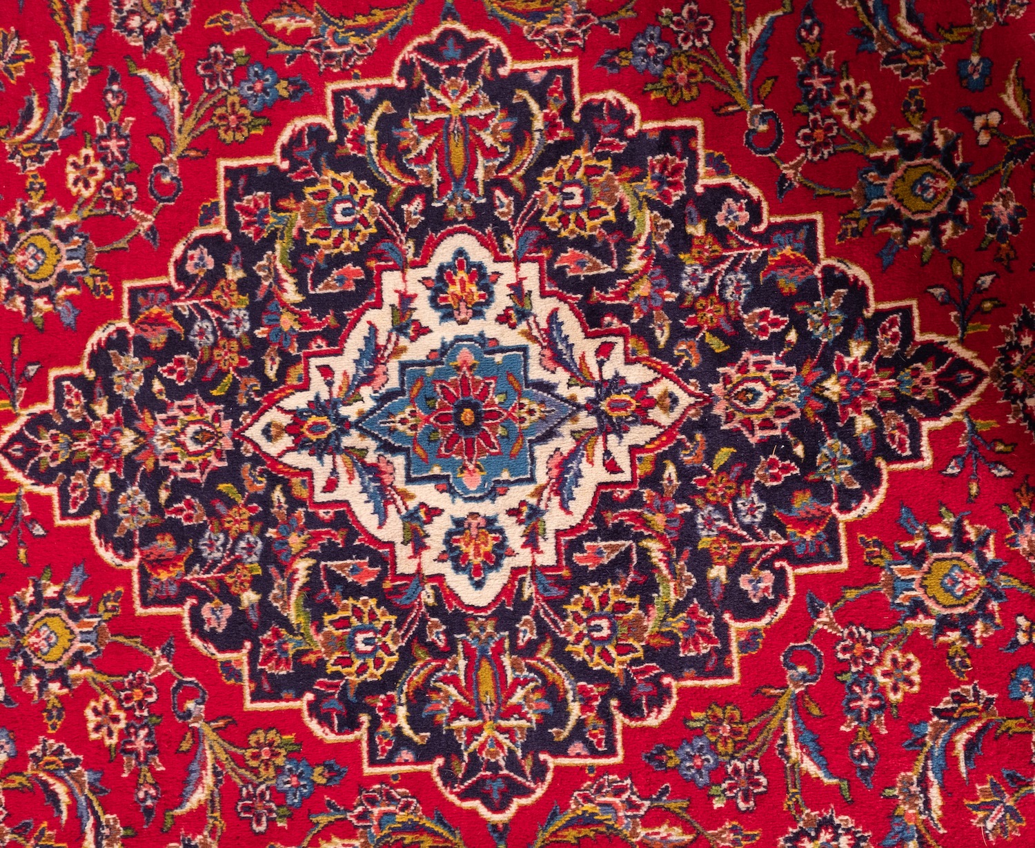 A Kashan carpet, the madder cartouche field with a central indigo shaped lozenge pole medallion, - Image 2 of 3