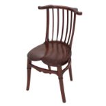 A carved mahogany child's chair in Arts & Crafts style,