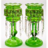 A pair of green glass table lustres with gilt and enamelled decoration,