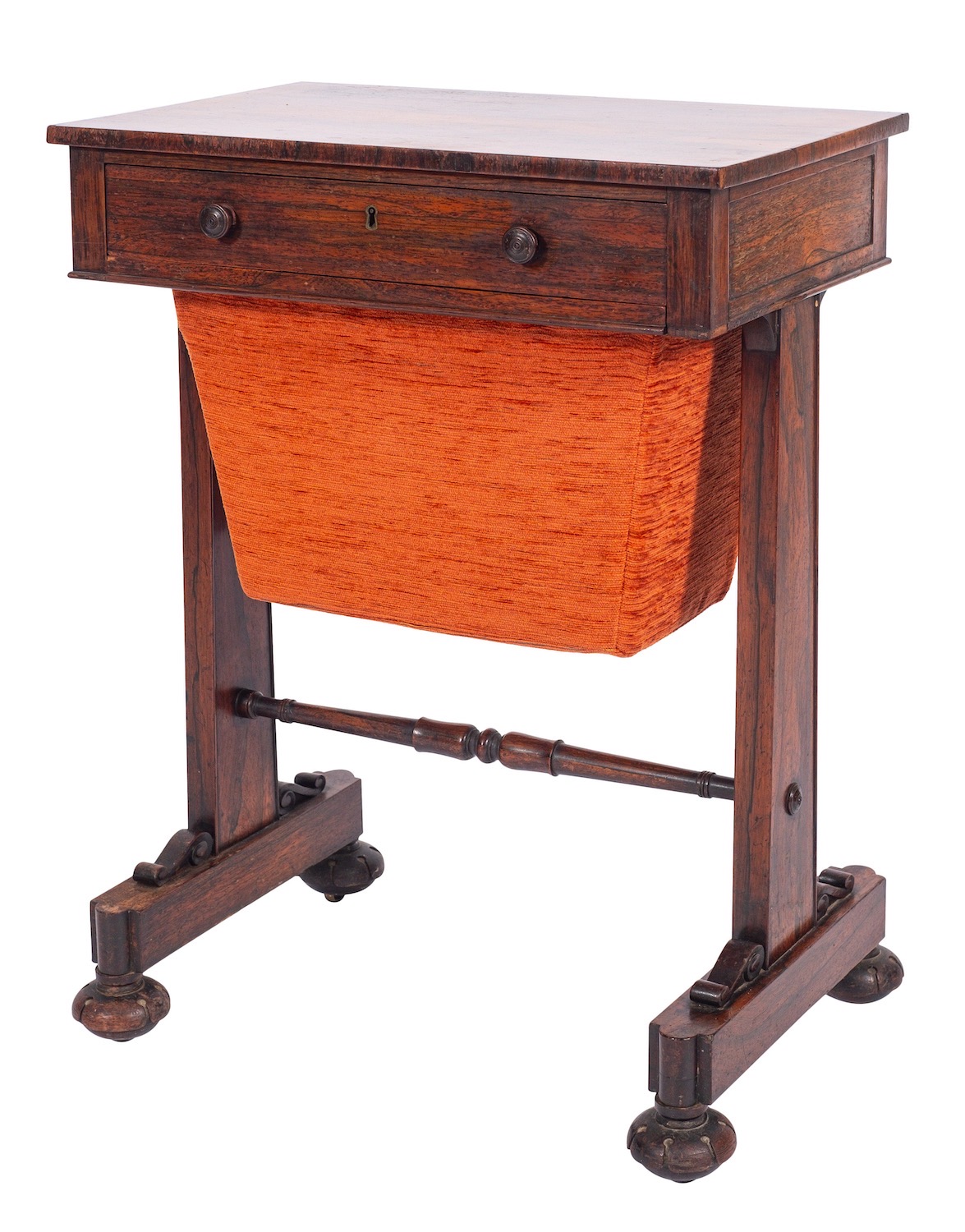 A Regency rosewood sewing table, circa 1815; the drawer with twin turned knob handles,