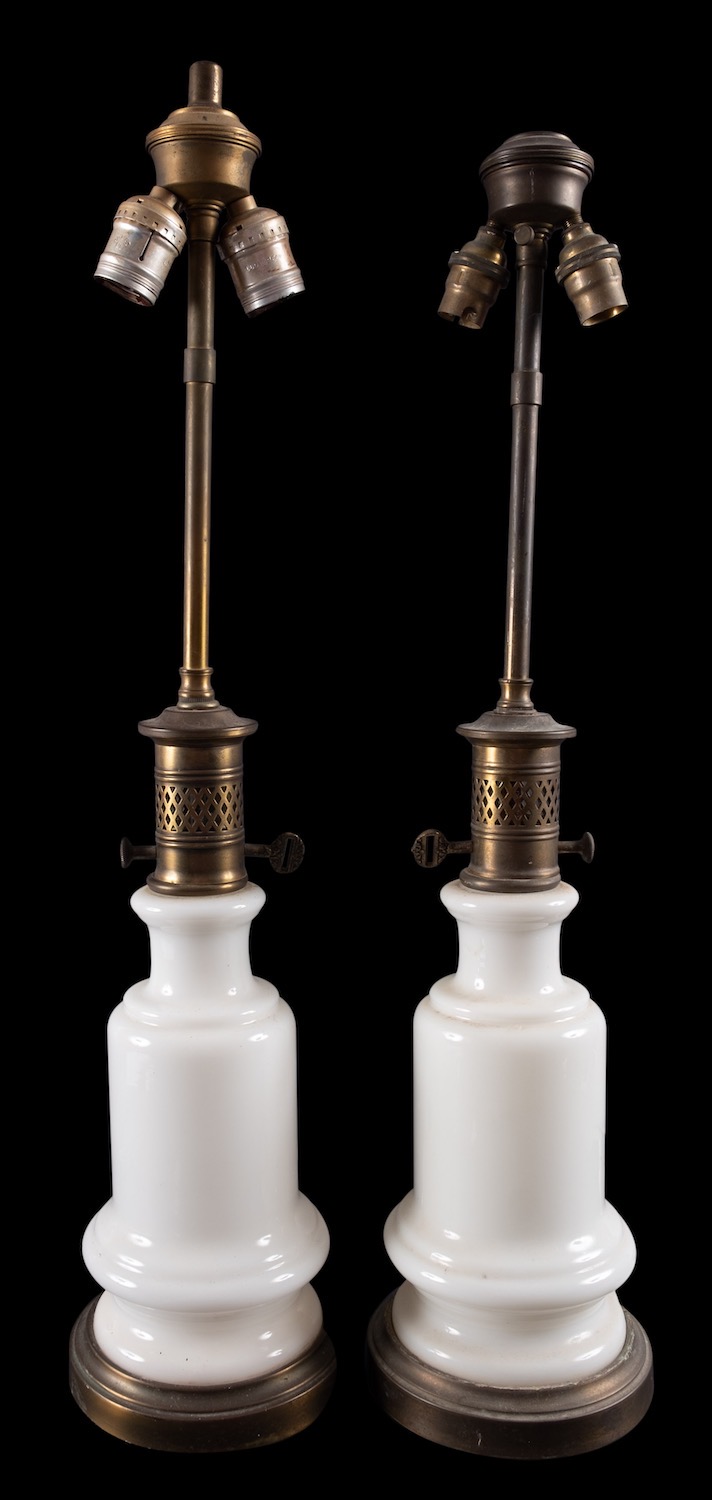 A pair of milk glass and brass mounted table lamps,