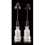 A pair of milk glass and brass mounted table lamps,