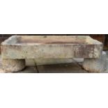 A rough hewn limestone trough, 18th / 19th century; of rectangular form,