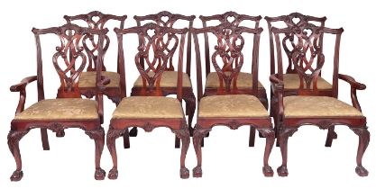A set of eight carved mahogany dining chairs in Chippendale style,