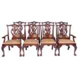 A set of eight carved mahogany dining chairs in Chippendale style,