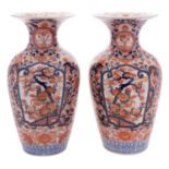 A pair of Japanese Imari vases each with waisted neck and flared rim,