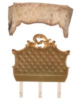 A carved giltwood and green upholstered headboard in Louis XV taste,