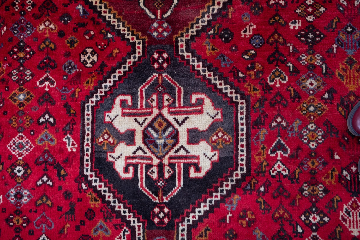 A Qashgai carpet, the rose field with triple hexagonal stepped central medallions, - Image 3 of 6