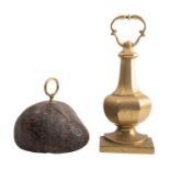 A brass door porter in the form of a faceted urn,