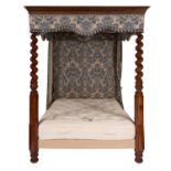A mahogany and fabric adorned four-post bed,