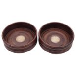 A pair of Elizabeth II silver mounted mahogany coasters of conventional turned form,