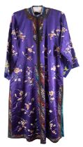 A Chinese hand-embroidered floral blue and purple silk robe,