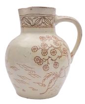 A North Devon slipware jug by Edwin Beer Fishley the cream slip sgraffito decorated with a sailing