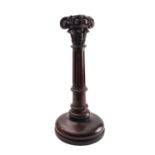 A carved and stained hardwood columnar table lamp,