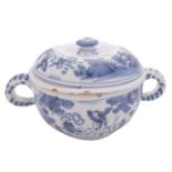 A Dutch Delft blue and white two-handled spiced wine bowl and cover with small internal strainer