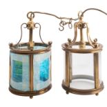 A pair of brass and glazed ceiling lanterns, in Regency taste,