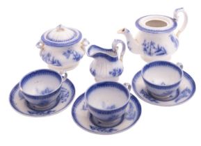 A Davenport pottery nursery tea set, decorated in flow blue with foliate sprigs,