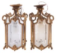 A pair of gilt metal and glazed ceiling lanterns in 18th century taste,