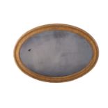 A George III giltwood and composition framed oval wall mirror,