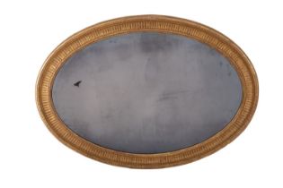 A George III giltwood and composition framed oval wall mirror,