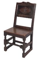 A Jacobean oak backstool, probably Lancashire,