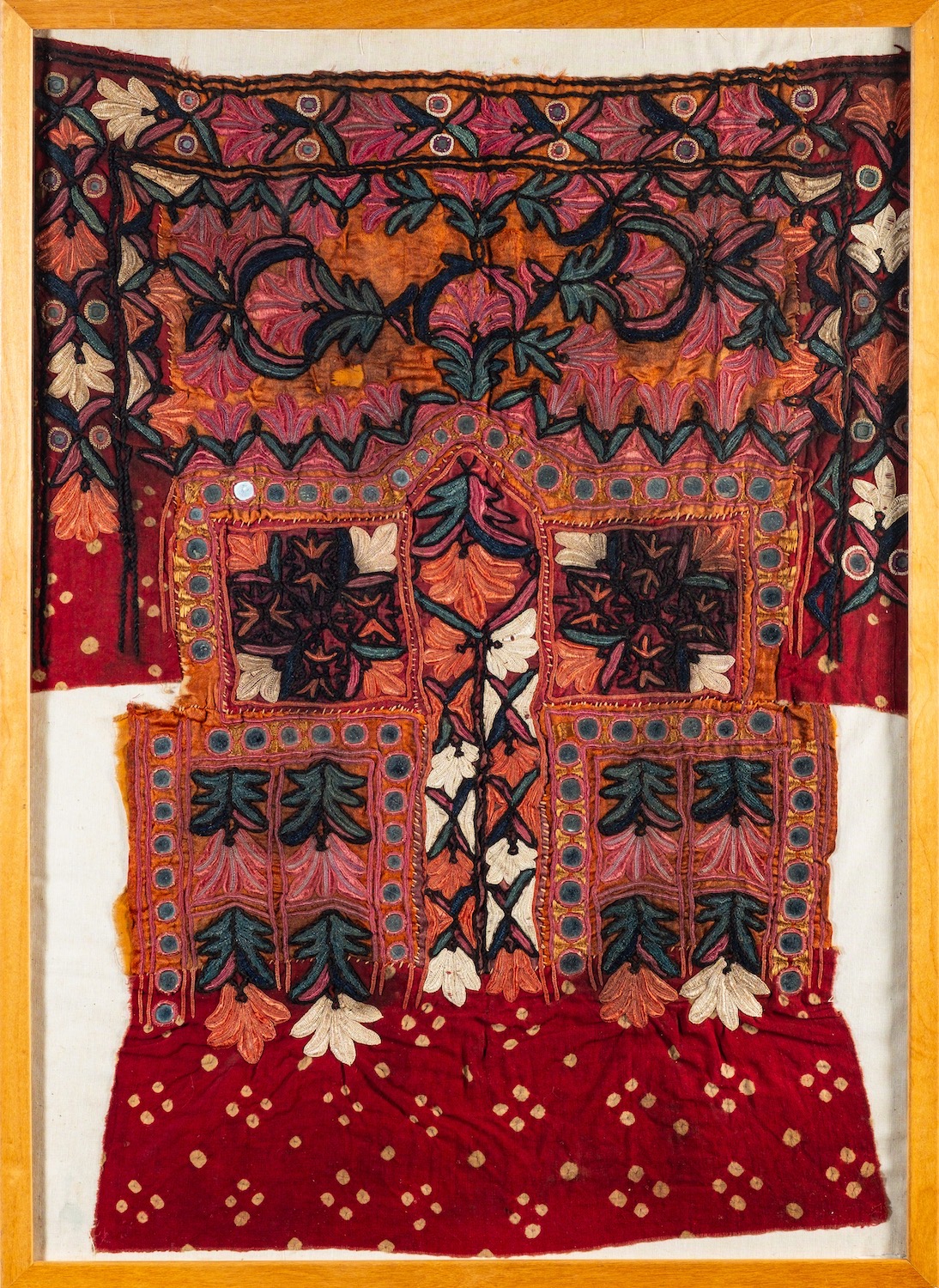 A Pakistani tribal silk embroidered fabric of stylised floral and geometric design, 19th,