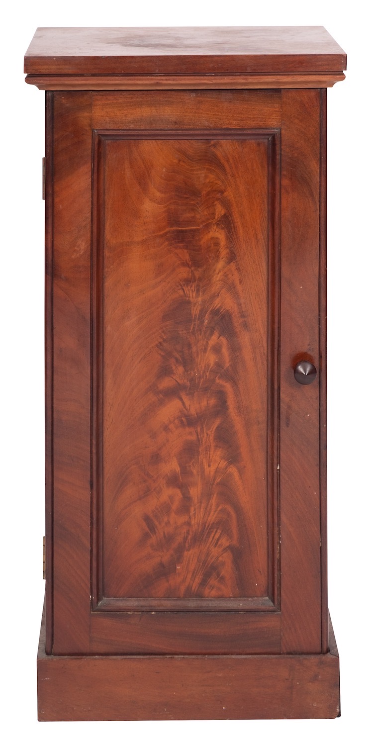 A Victorian mahogany pot cupboard, mid 19th century; the top with moulded lower edges,