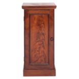 A Victorian mahogany pot cupboard, mid 19th century; the top with moulded lower edges,