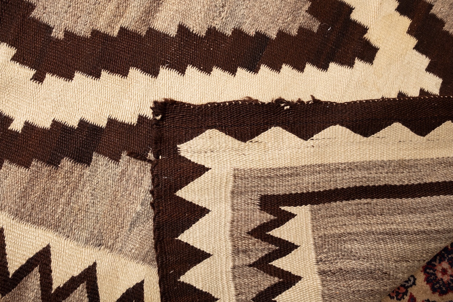 A Navajo flatweave, the beige field with a central chocolate brown and ivory lozenge medallion, - Image 6 of 10