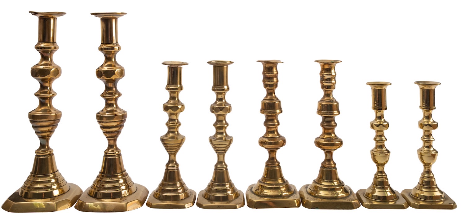Three pairs of Victorian brass candlesticks,