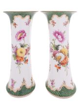 A pair of Dresden porcelain beaker vases painted in the Meissen style with floral sprays and sprigs