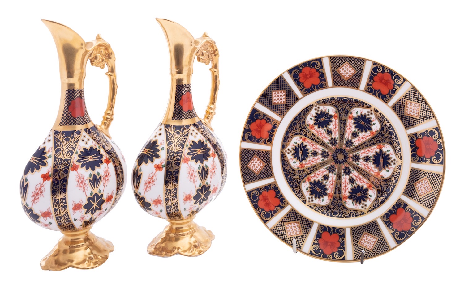 A pair of Royal Crown Derby ewers of flattened pedestal form decorated with an Imari pattern,