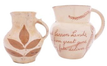 A North Devon slipware jug by Alexander Lauder and one other the first sgraffito decorated with a