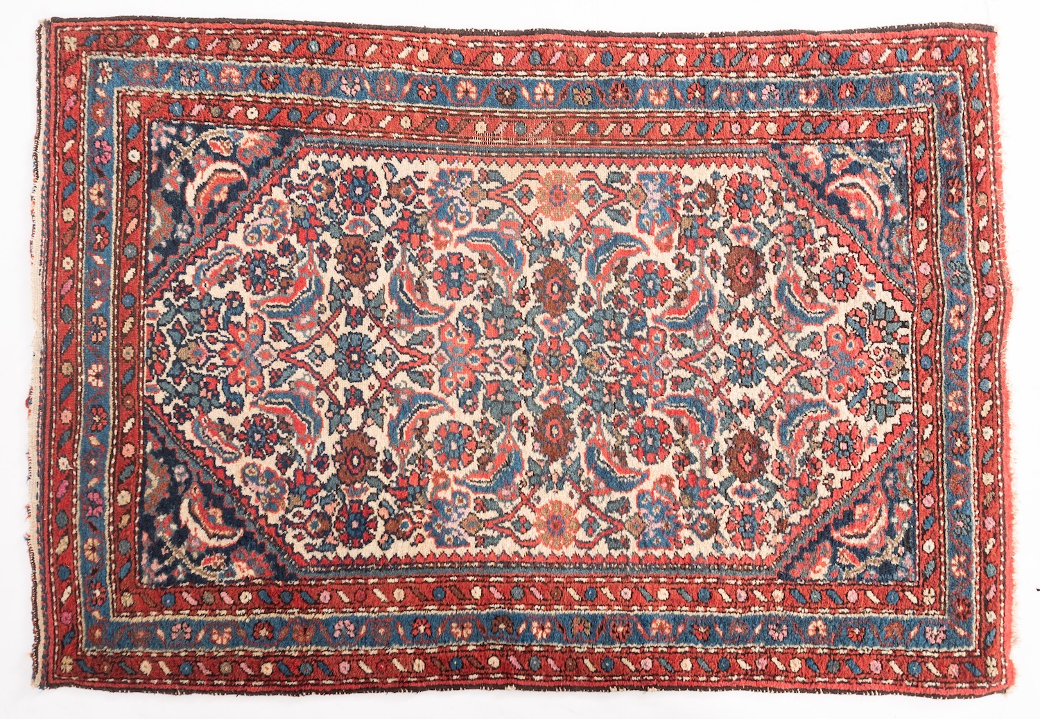 A Hamadan rug, the ivory octagonal field with an all over floral foliate and palmette design,