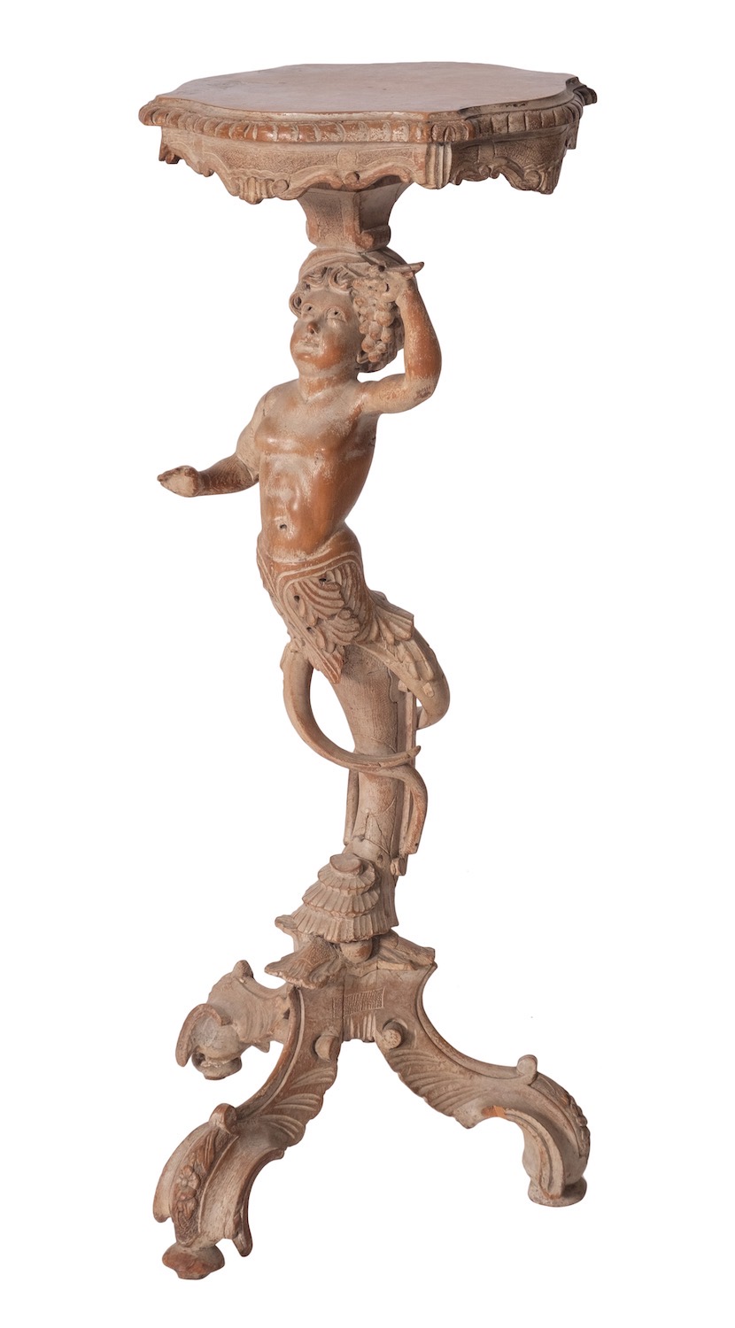 A north Italian carved limewood torchere stand, in Baroque style,