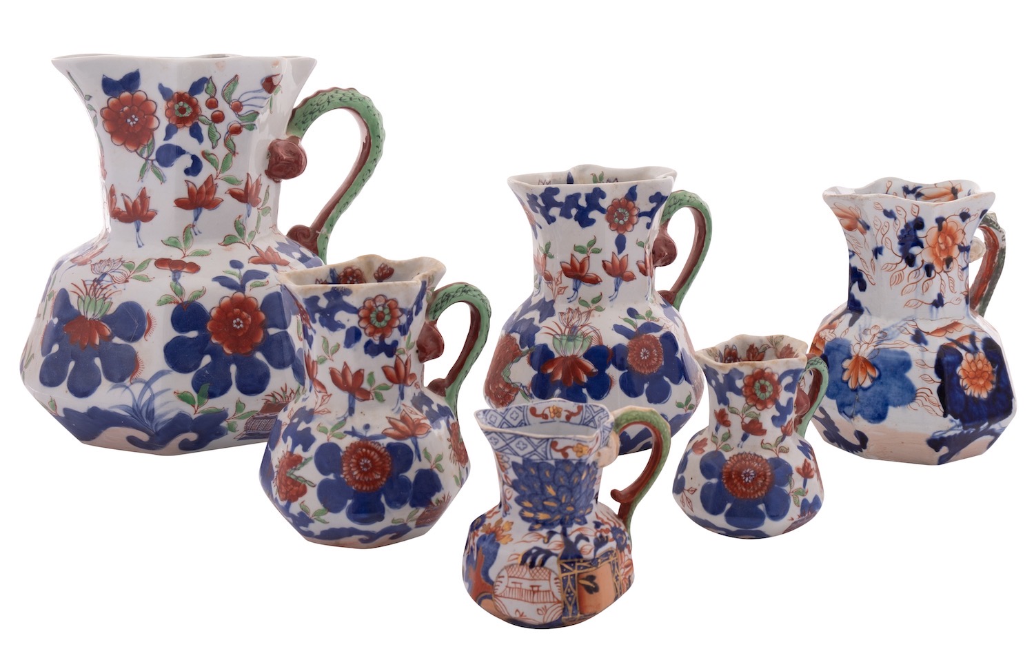 A mixed lot comprising a graduated set of four reproduction Mason's-style Ironstone Hydra jugs,