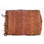 A Turkish Kilim bag, early 20th century; rectangular, with bands of geometric designs in red, black,