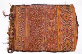 A Turkish Kilim bag, early 20th century; rectangular, with bands of geometric designs in red, black,