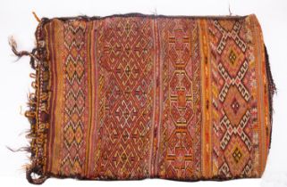 A Turkish Kilim bag, early 20th century; rectangular, with bands of geometric designs in red, black,