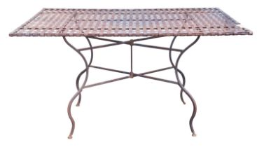 A lattice-worked wrought iron rectangular garden table,