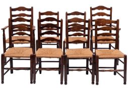 A composed set of eight ash and rush seated ladderback chairs,