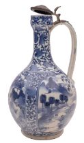 A Japanese Arita ewer of garlic shape with strap handle and pewter mounts,