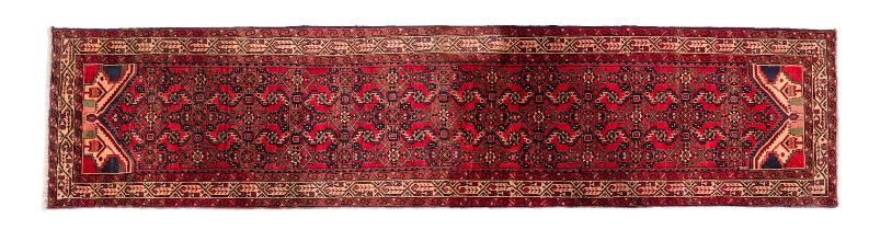A Malayer runner, the brick red field with an all over geometric design,